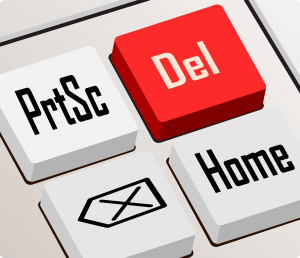 red delete button on keyboard depicting how to delete social media accounts