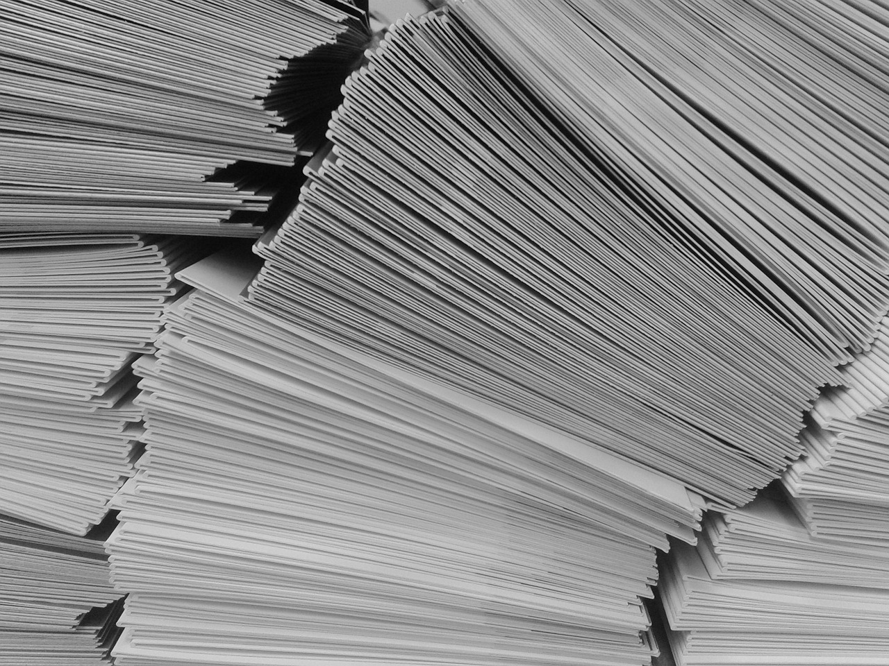 Piles of envelopes falling over - ditch this and go digital!